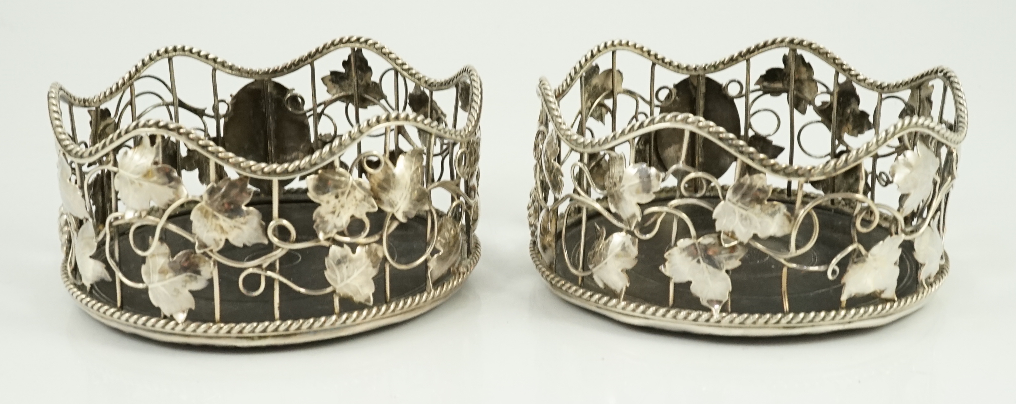 A pair of George III silver mounted wine coasters, by William Plummer